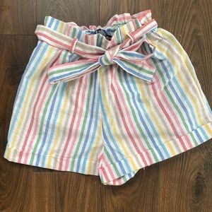 Rainbow striped white shorts.